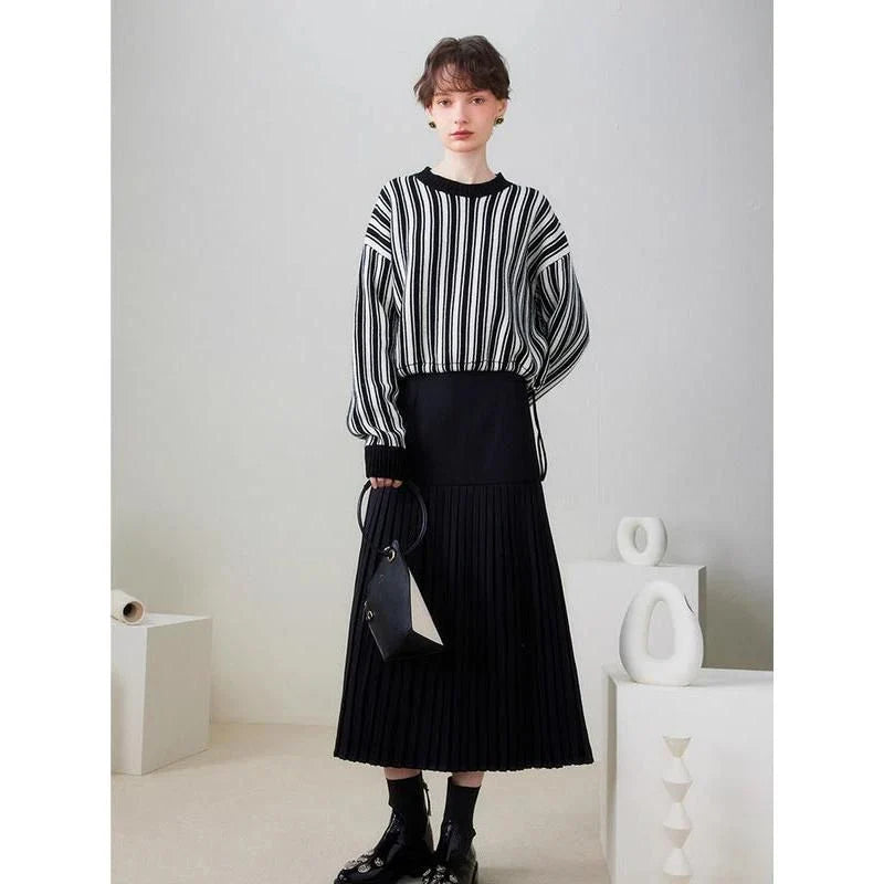 A chic striped wool-blend jumper in black, featuring an elegant O-neck design and a relaxed, flattering fit