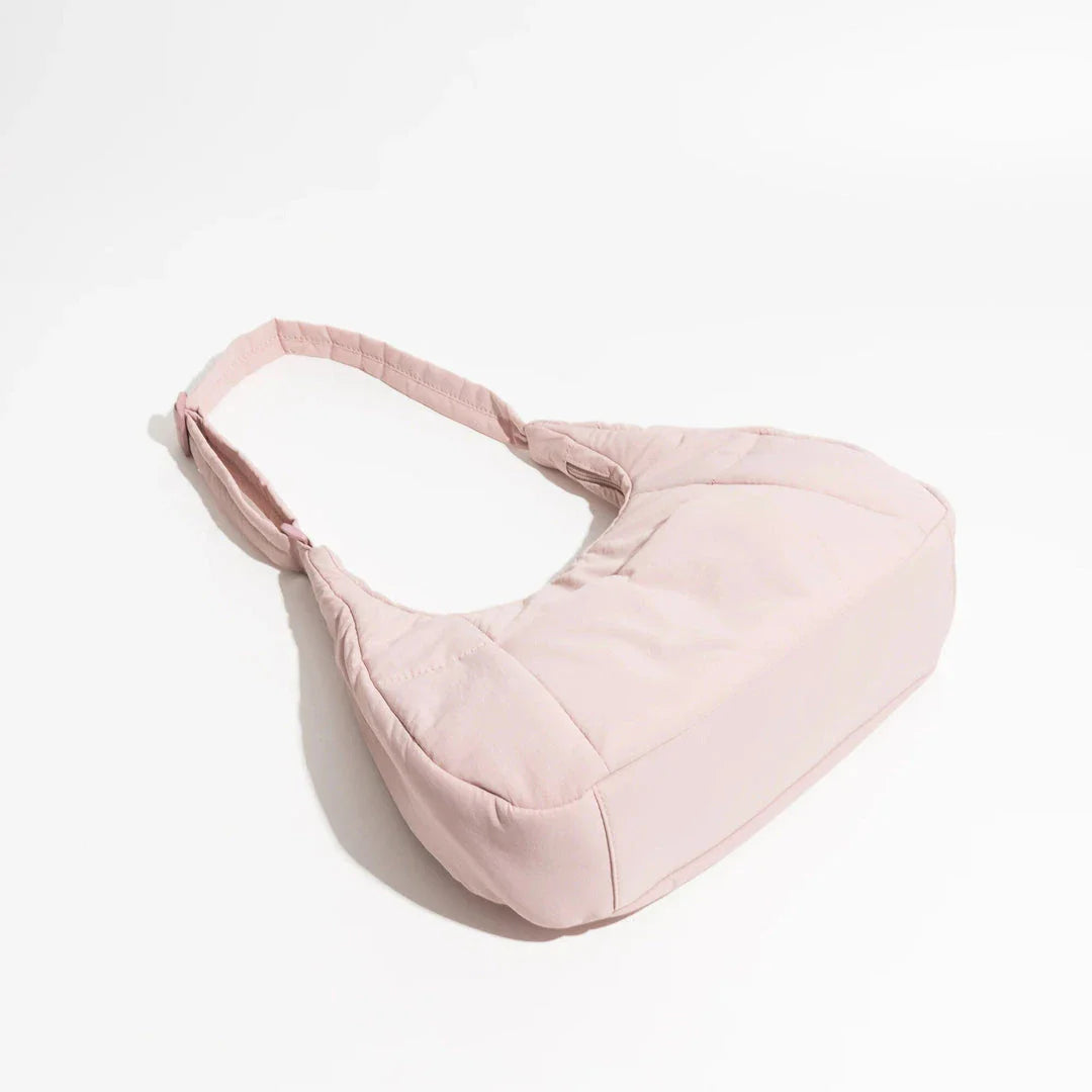 Chic Half Moon Puffer Shoulder Bag in a stylish pink colour, featuring a unique design and practical features for the modern woman.