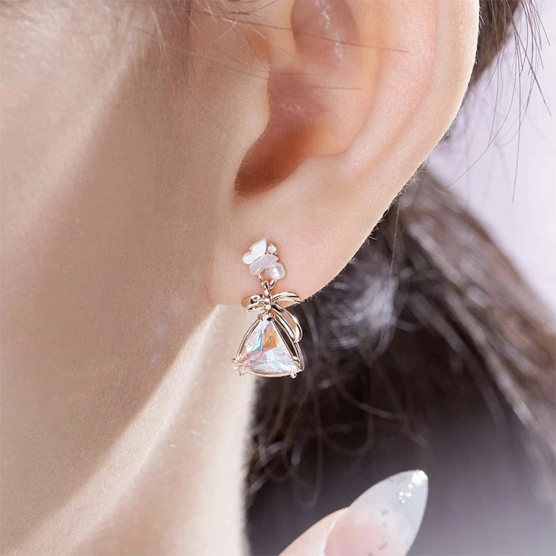 Elegant sterling silver butterfly earrings with a delicate and whimsical design, perfect for adding a touch of natural beauty to any outfit.