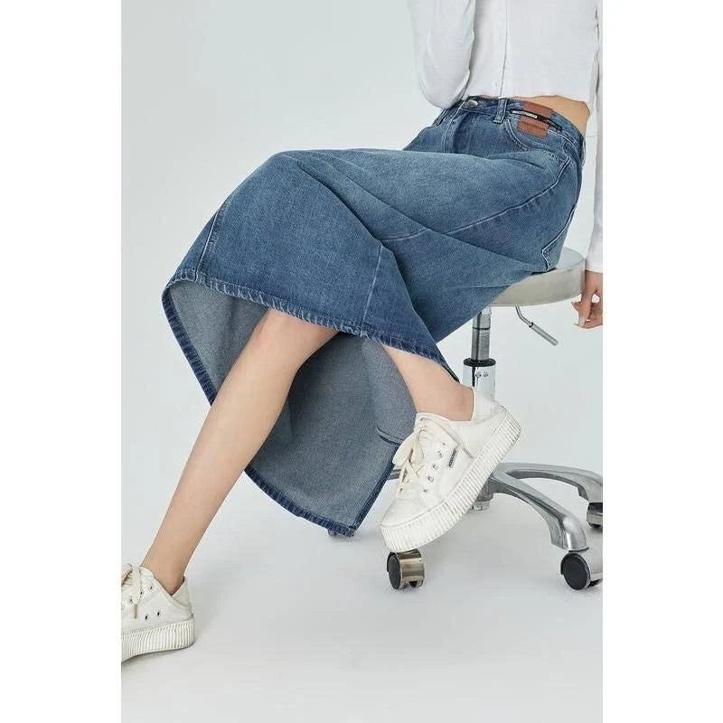 Classic blue A-line midi denim skirt with flattering empire waistline and flowy silhouette