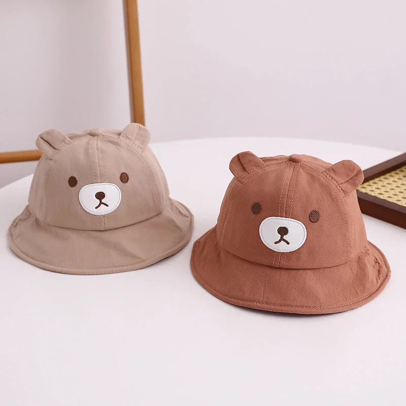 Adorable kids' bear-themed panama bucket hat with soft, breathable fabric and adjustable fit for sun protection and style