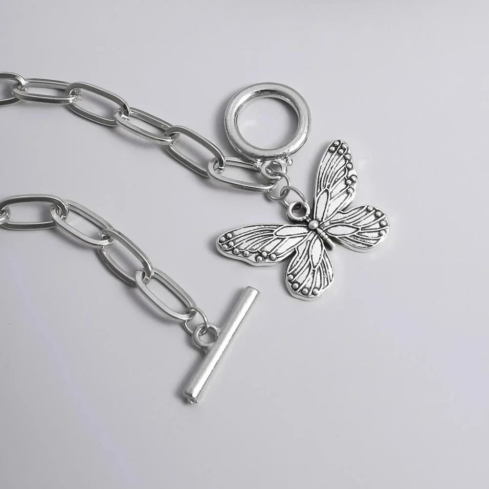Silver butterfly pendant bracelet with a delicate chain and charming bowknot design