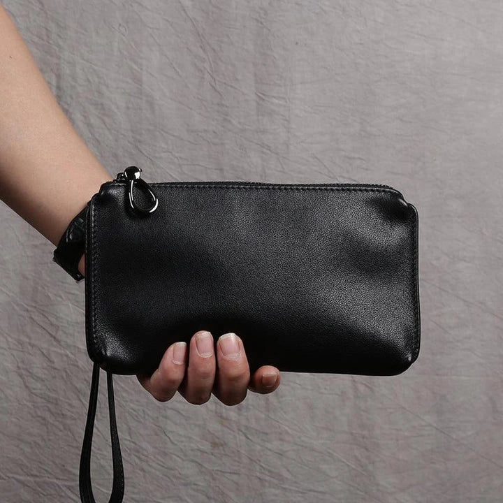 Premium genuine leather handbag in a sleek, contemporary design with secure zipper closure and internal organisation pockets