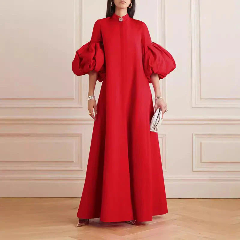 Elegant floral evening gown in a range of vibrant colours, featuring a loose, flattering fit and chic lapel design