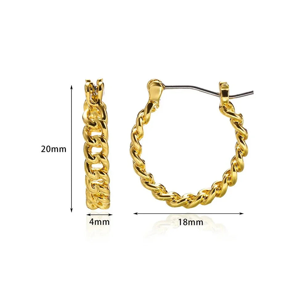 A pair of gold-toned stainless steel hoop earrings, showcasing a classic and sophisticated design
