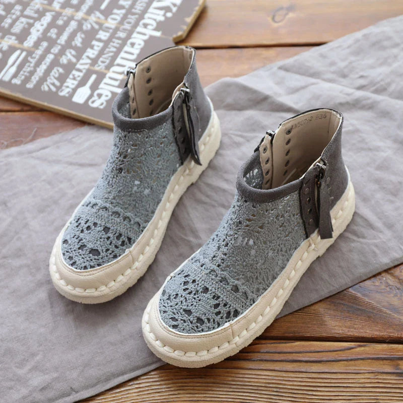 Stylish flat-soled women's Martin boots in grey and beige colours, featuring a durable denim upper and sturdy rubber sole for all-day comfort and support.