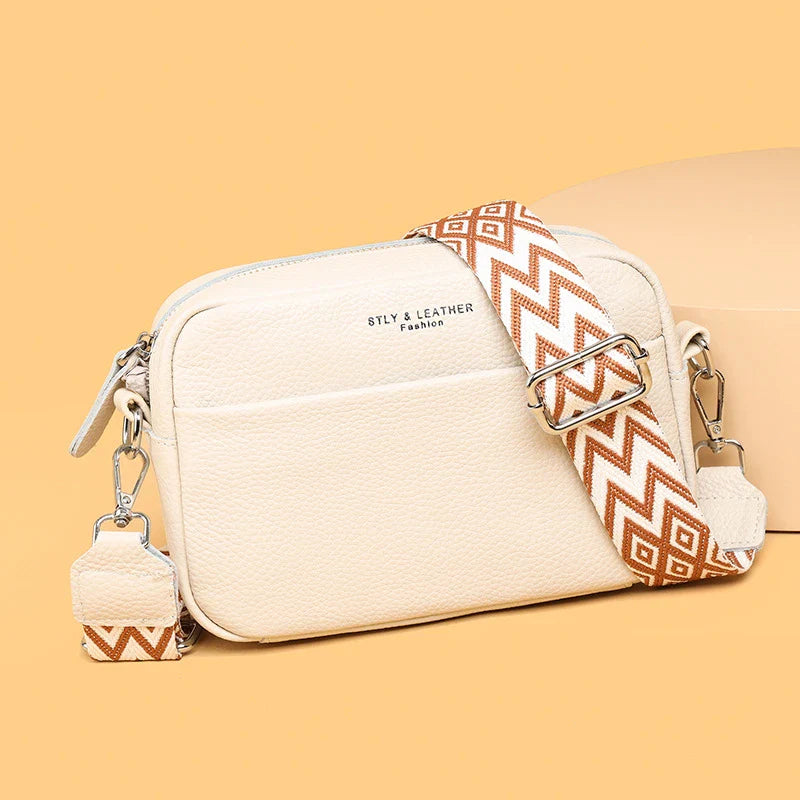 Stylish leather crossbody bag with embroidered strap in various colours