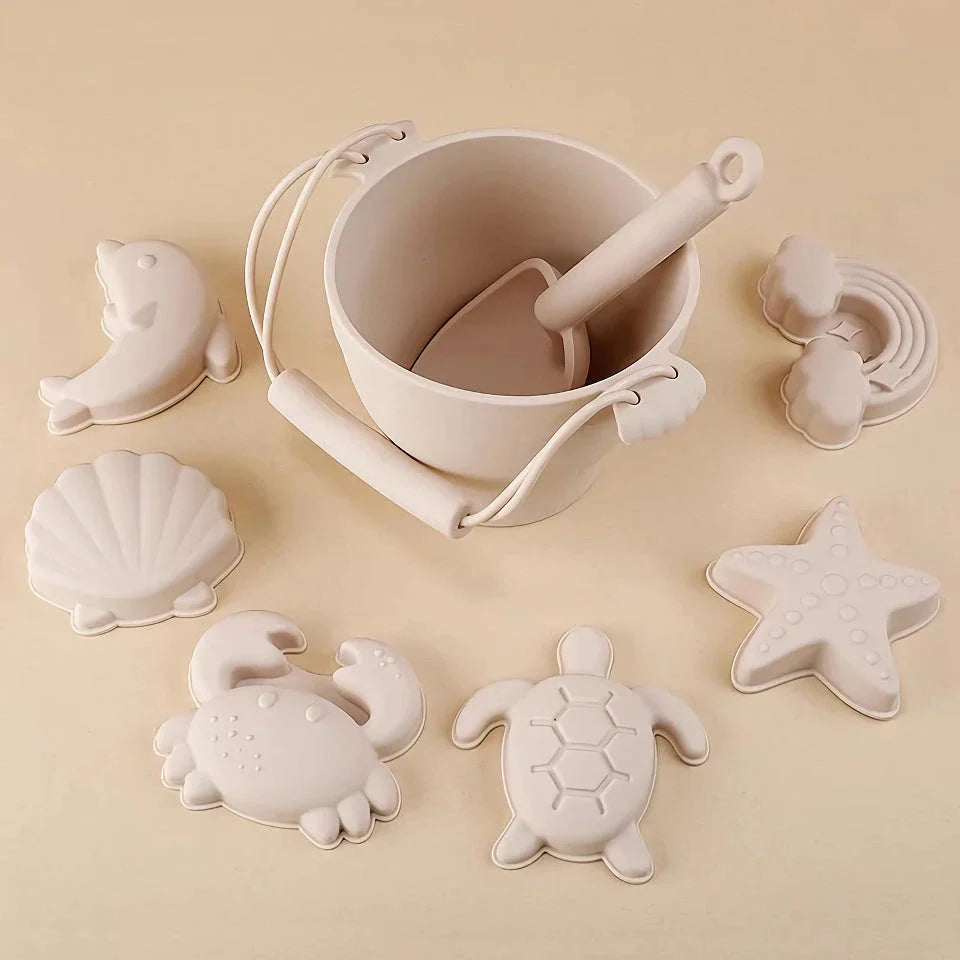 Premium eco-friendly silicone beach playset with bucket, spades, and themed molds for children's creative outdoor play
