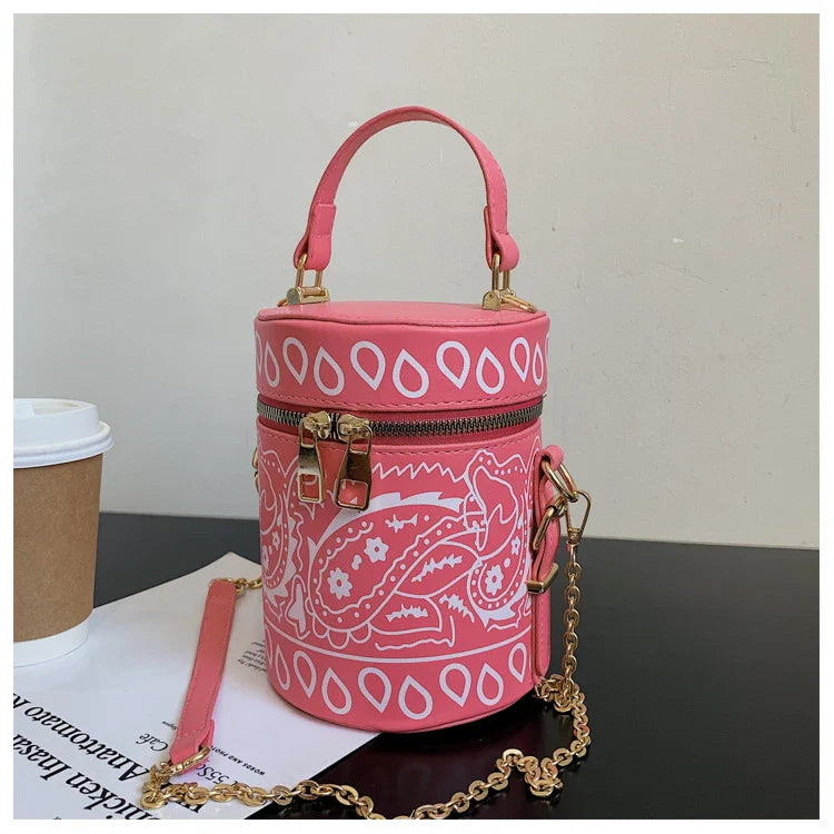 Premium PU leather bucket bag in a variety of classic and contemporary colours, featuring a spacious main compartment, adjustable shoulder strap, and sophisticated British-inspired design.