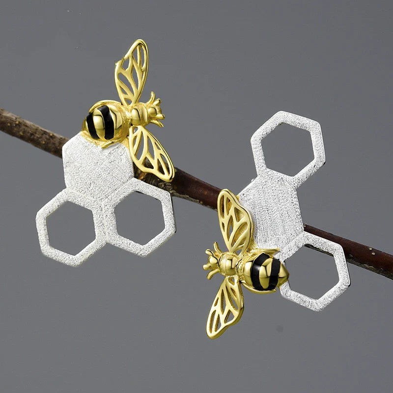Elegant sterling silver beehive-inspired stud earrings with a nature-inspired design, perfect for fashion-conscious women