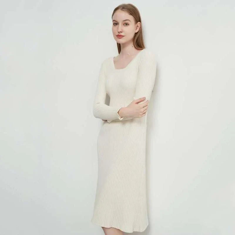 Elegant and cosy midi sweater dress in black, featuring a solid, body-hugging silhouette and comfortable knit fabric