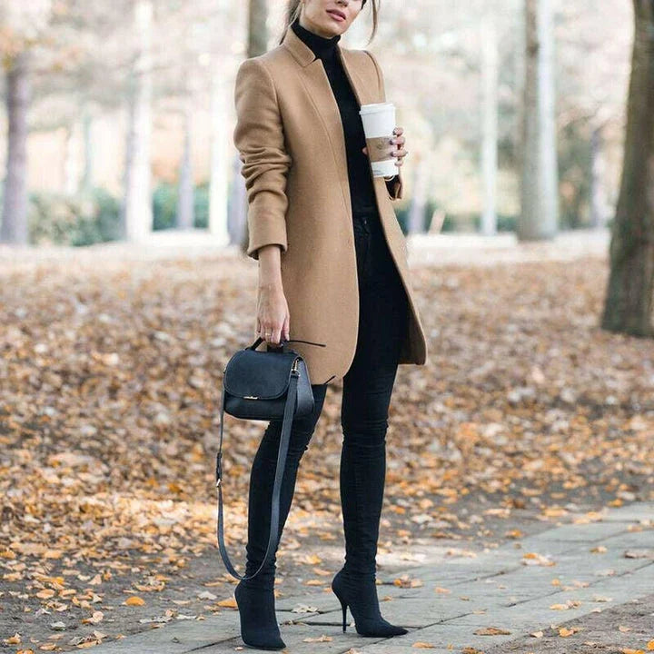 Premium British woollen coat with stand collar, featuring a sleek, slim-fit silhouette and subtle stitching details
