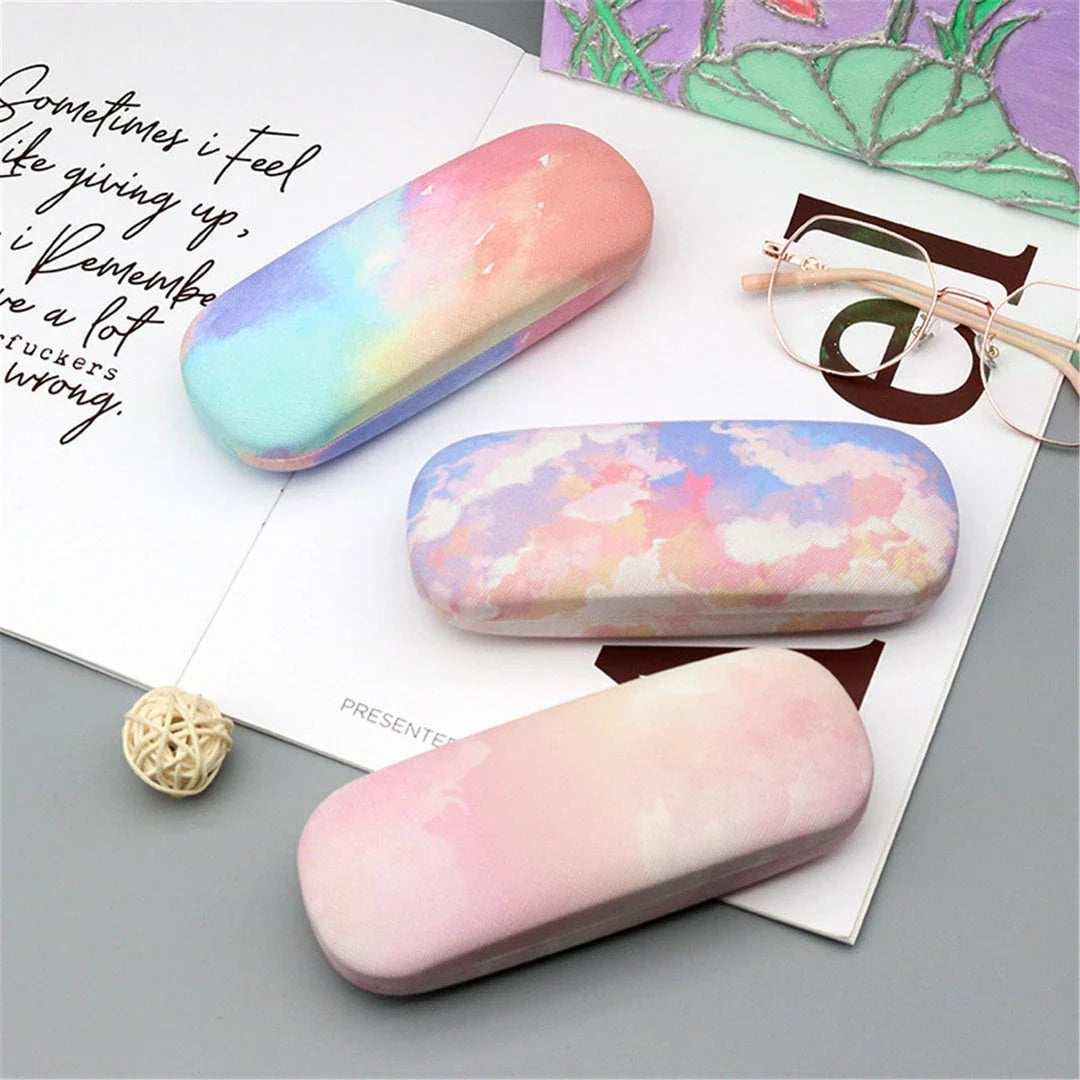 Gradient cloud printed eyewear case with metal frame and PU leather construction, protecting glasses from scratches and everyday wear and tear