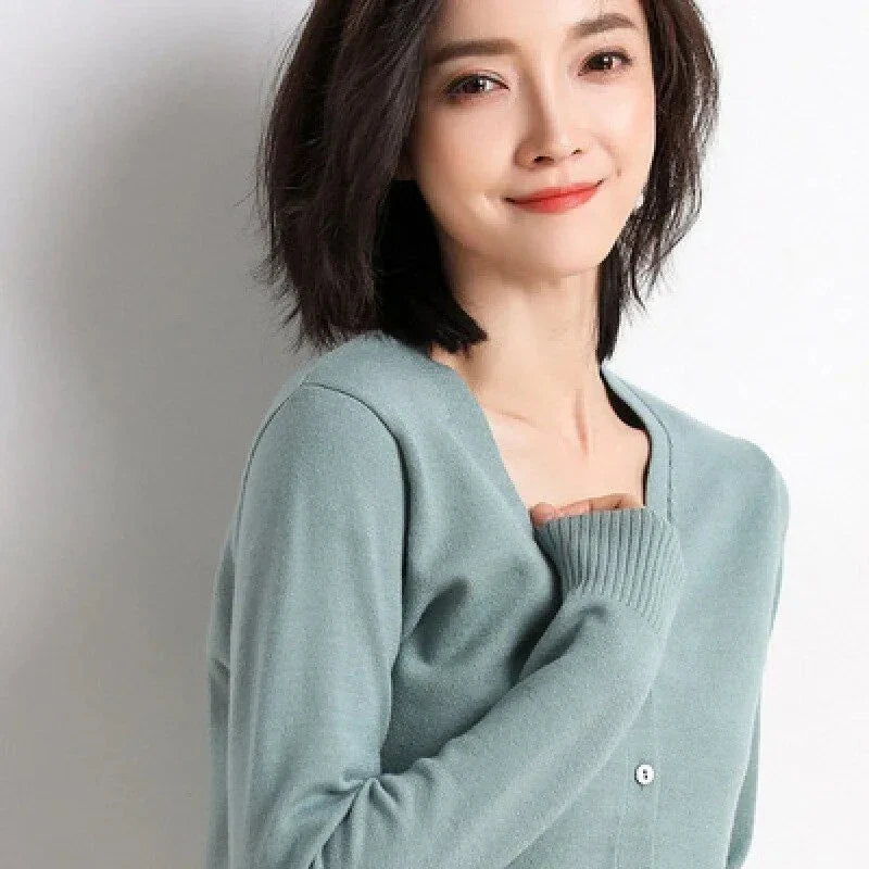 Chic v-neck single breasted cardigan in blue, green, and pink colours with a sophisticated and timeless design