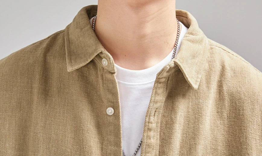 A relaxed, loose-fitting men's shirt in a retro-inspired design, crafted from premium cotton for exceptional comfort and style.