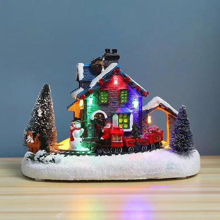 Luminous Christmas house decorations made of resin, with a warm glowing light creating a festive winter scene