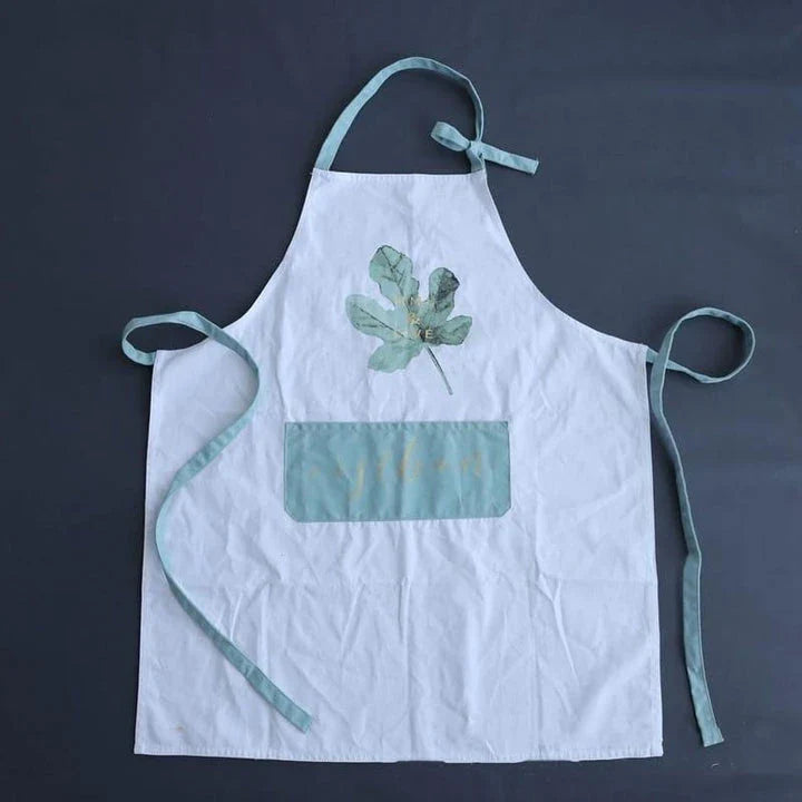 Premium cotton barista apron with a beautiful coconut leaf print design, perfect for coffee shop staff