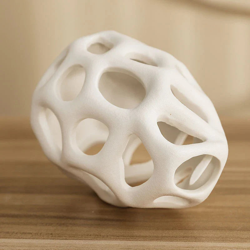 Stylish ceramic decorative balls in geometric design, available in white and black, small and large sizes, for modern home decor