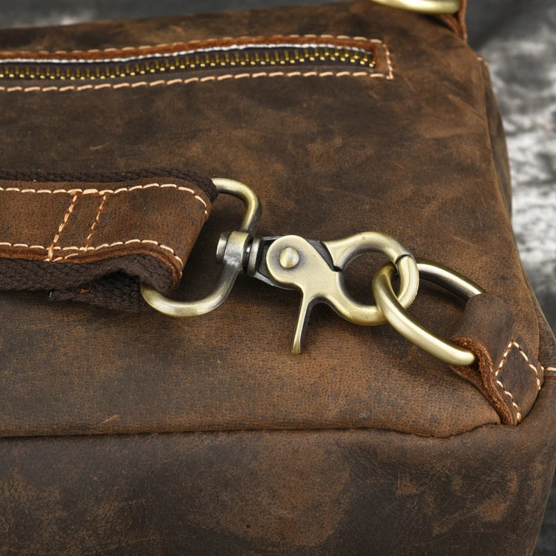 Vintage-inspired genuine leather briefcase with multiple compartments and secure zipper closure, ideal for modern commuters