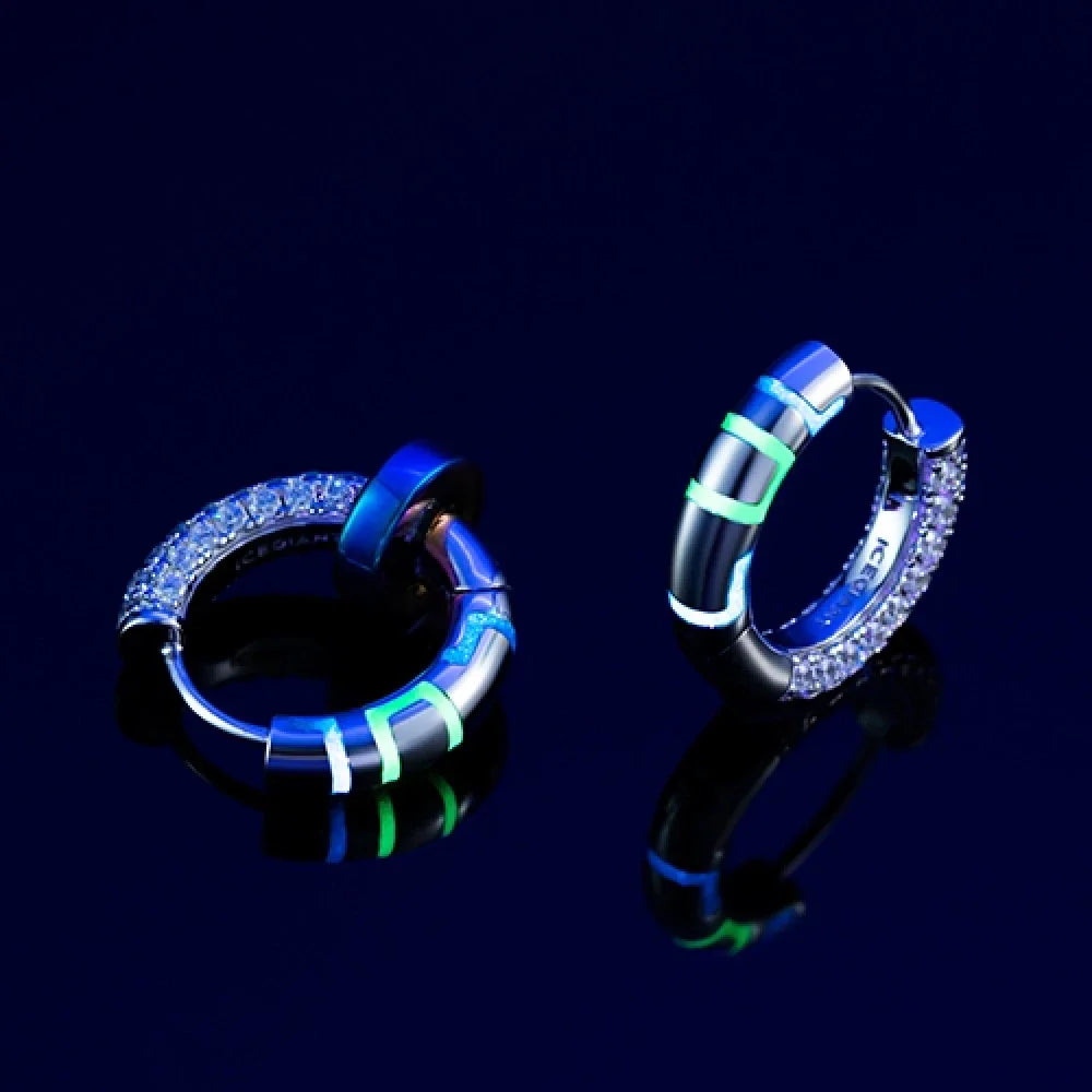 Sterling silver earrings with luminous accents, providing a soft, gentle glow for a touch of elegant sophistication.