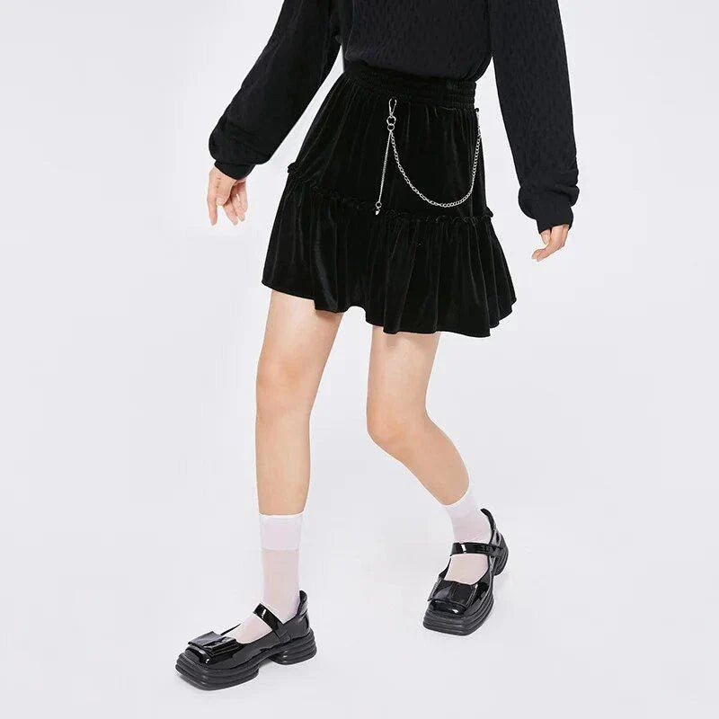 A stylish and playful above-knee mini skirt with intricate chain detailing, offering a versatile and fashionable addition to any wardrobe.