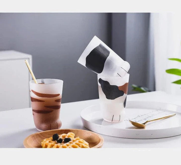 Charming cat paw shaped glass mug with a generous 301-400 ml capacity, perfect for enjoying your favourite hot beverage