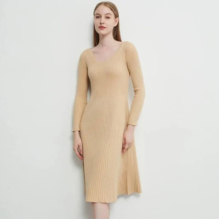 Elegant and cosy midi sweater dress in black, featuring a solid, body-hugging silhouette and comfortable knit fabric