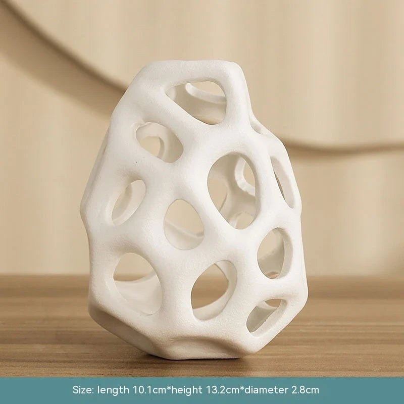 Stylish ceramic decorative balls in geometric design, available in white and black, small and large sizes, for modern home decor