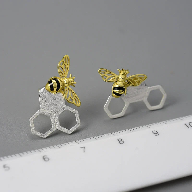 Elegant sterling silver beehive-inspired stud earrings with a nature-inspired design, perfect for fashion-conscious women