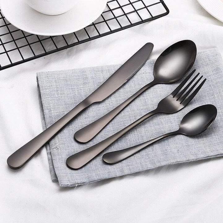 Premium eco-friendly stainless steel tableware set including knife, fork, spoon, and tea spoon in a sophisticated frosted finish