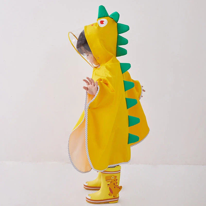 A colourful dinosaur-themed waterproof rain poncho for children, designed to keep them dry and happy during outdoor activities.