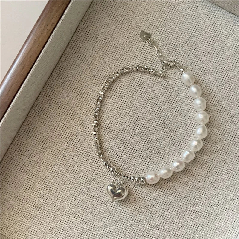 Elegant heart-shaped pearl necklace in sterling silver, a timeless British-inspired accessory