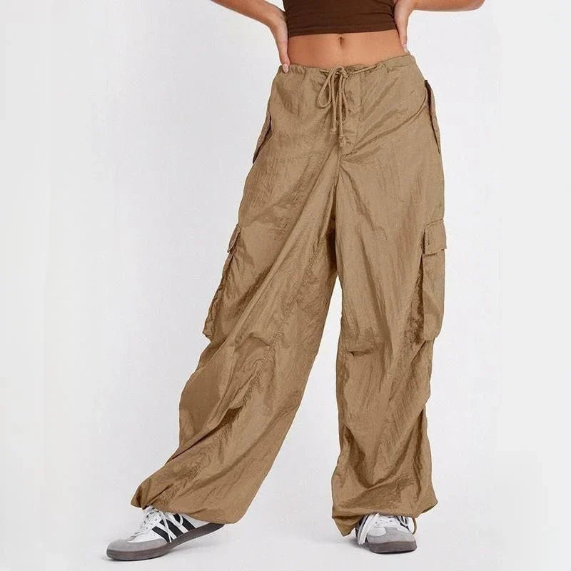 Stylish high-waist safari-inspired cargo trousers for women in black, featuring a comfortable, flattering fit and practical pockets.