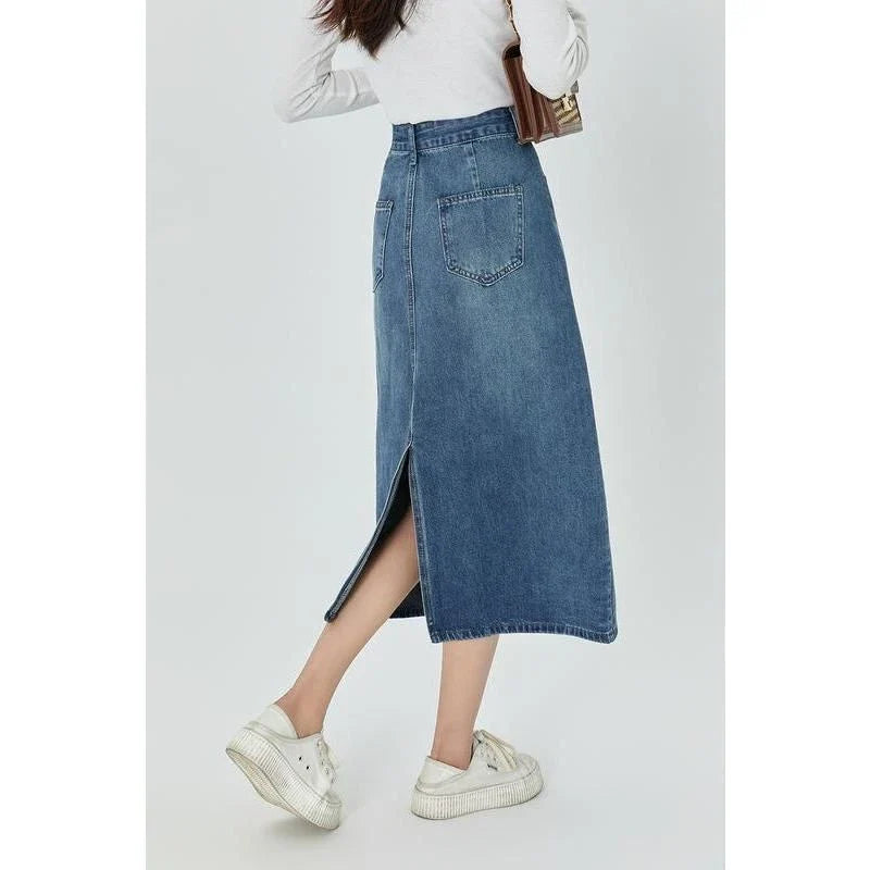 Classic blue A-line midi denim skirt with flattering empire waistline and flowy silhouette