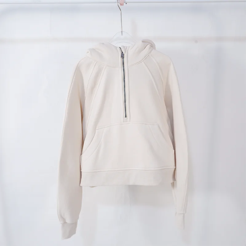 Premium women's sports fleece hoodie with half zip, available in a range of sophisticated colours