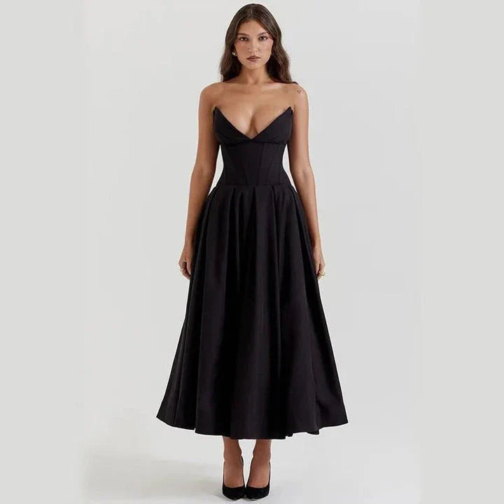 Elegant, backless A-line midi dress in black for women, featuring a sleek silhouette and sophisticated draping