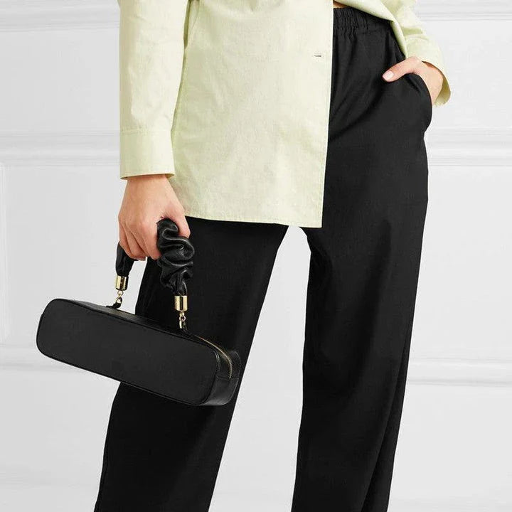 Sophisticated long shoulder diagonal bag with a sleek horizontal square design, made of durable synthetic leather and featuring a single shoulder strap for hands-free convenience.