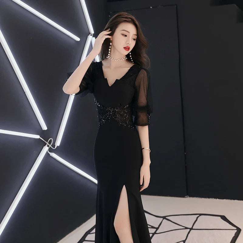 Elegant black evening dress with middle-length sleeves, perfect for formal occasions in the UK