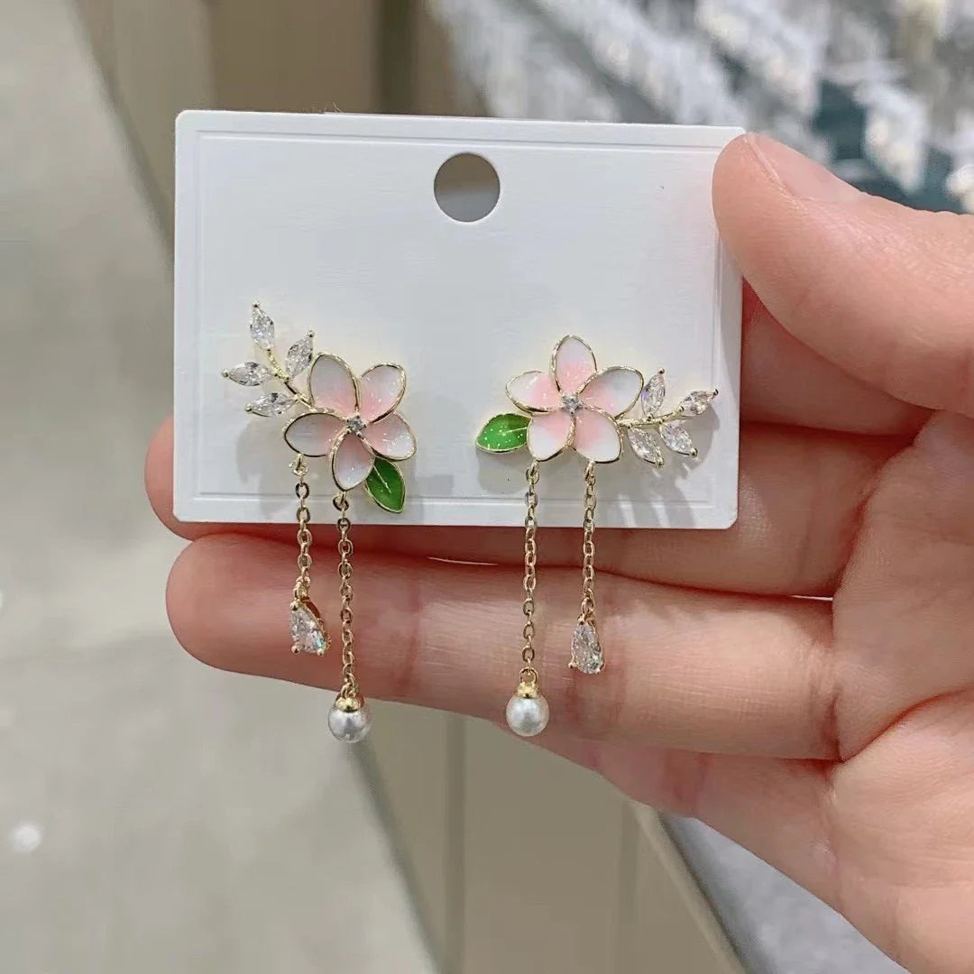 Elegant zircon flower long pearl tassel earrings in silver and gold tones, showcasing a captivating floral design and luxurious cascading tassels
