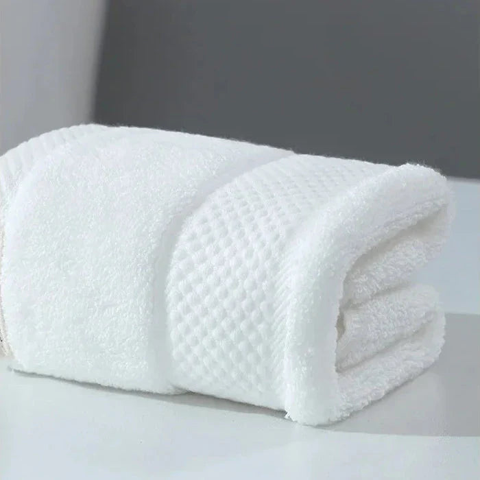 Premium 100% cotton face towel in blue, featuring a soft and absorbent design for daily facial cleansing and bathing
