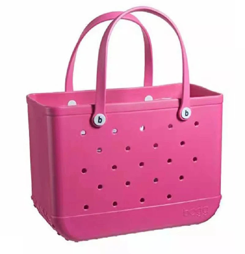 Premium waterproof beach tote bag in various vibrant colours, featuring spacious main compartment and multiple pockets for organised storage