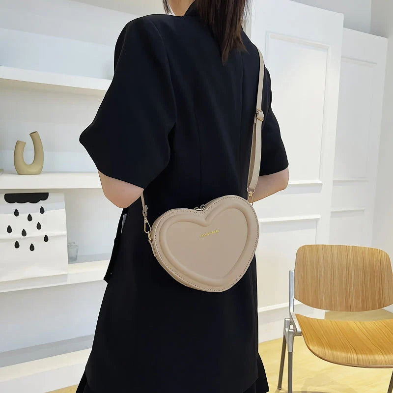 Chic heart-shaped crossbody bag made from premium PU leather, available in multiple stylish colours