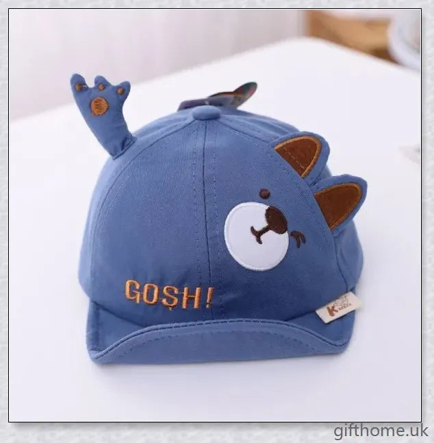Adorable cartoon baby cap in various colours, made of breathable linen-blend fabric for comfort and sun protection
