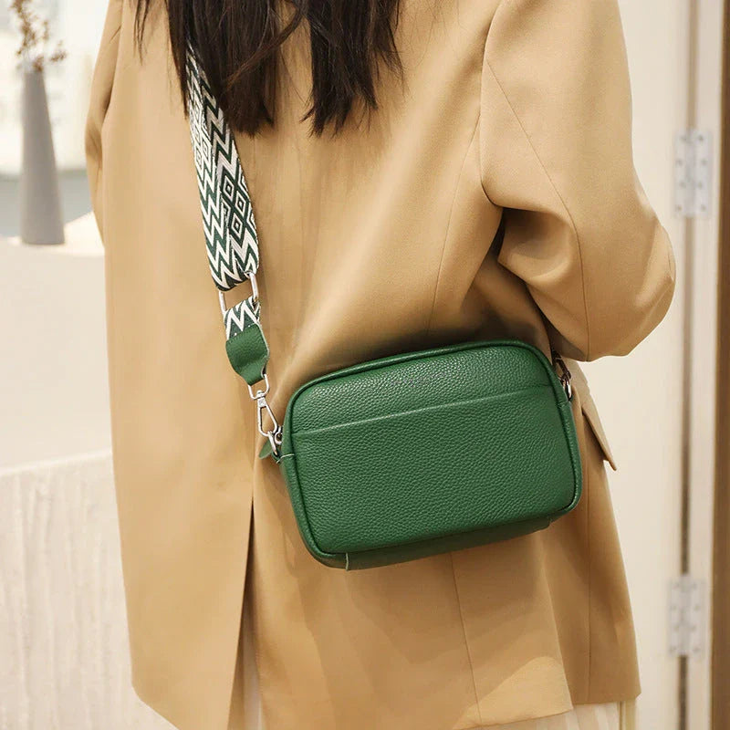 Stylish leather crossbody bag with embroidered strap in various colours