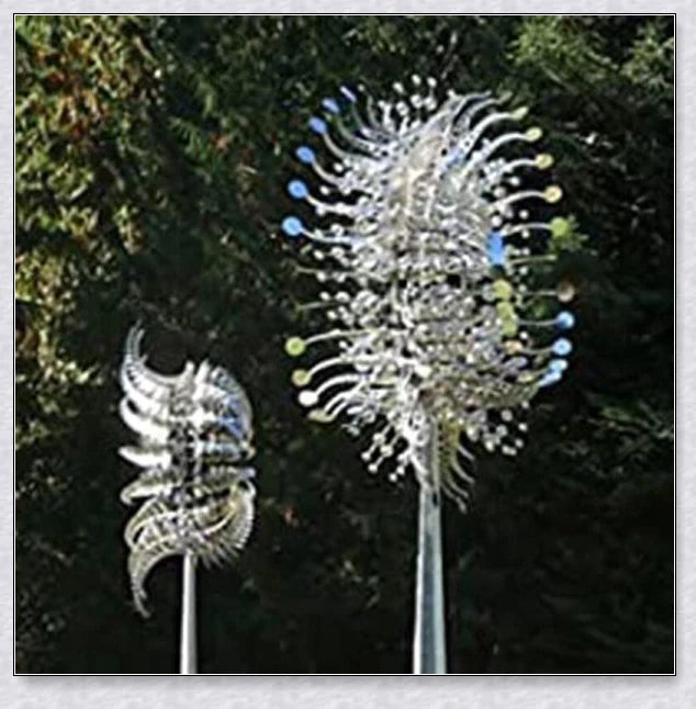 Elegant wind-powered kinetic sculpture with dual-motion blades and metallic construction, creating a mesmerizing visual display in any outdoor setting