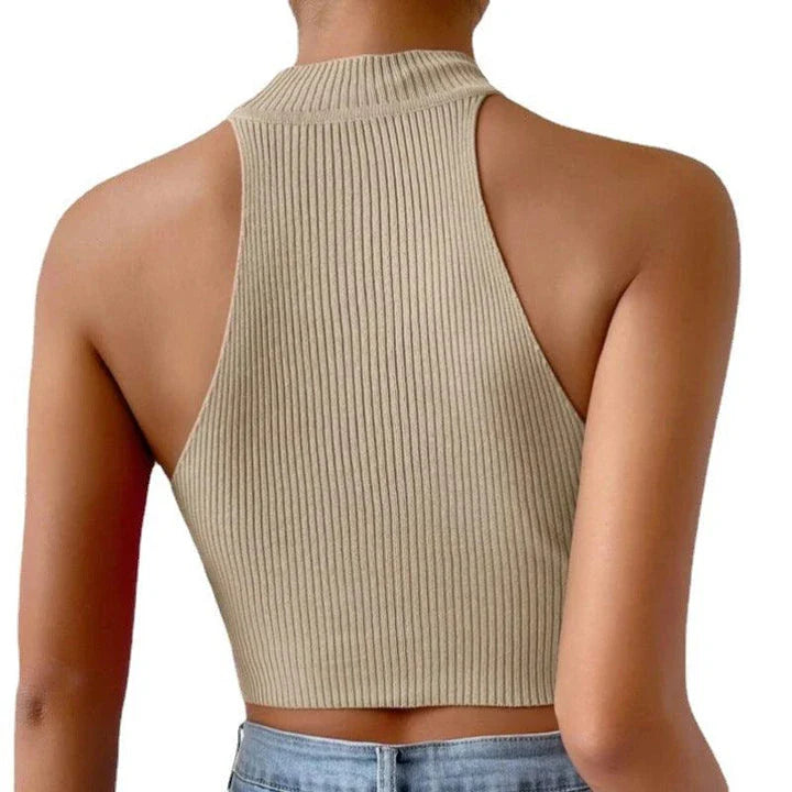 A stylish knitted camisole top in beige and peacock blue colours, featuring a slim-fit design and exposed navel detail for a trendy British fashion look.