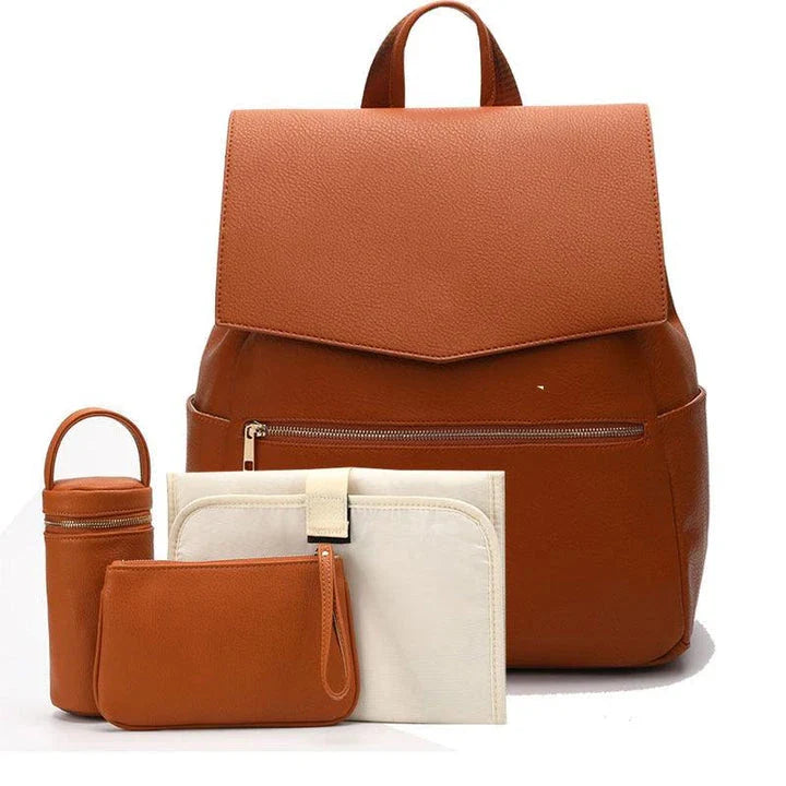 A stylish and practical PU leather mummy bag with a large capacity, multiple pockets, and included accessories like a changing pad and stroller hooks.