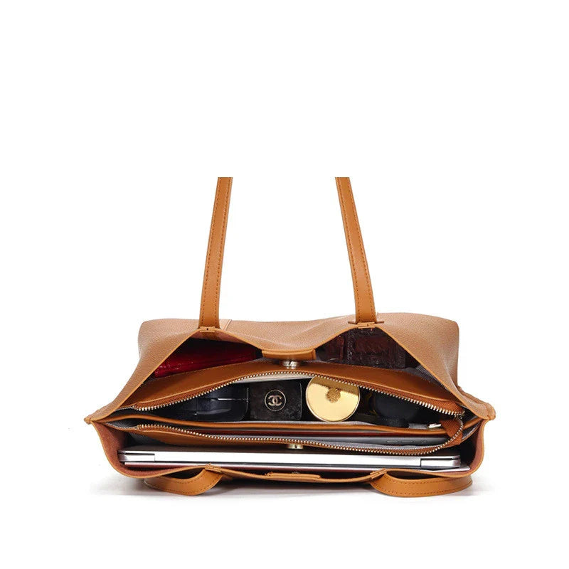 Premium cowhide leather shoulder bag with multiple compartments and adjustable strap for versatile everyday use