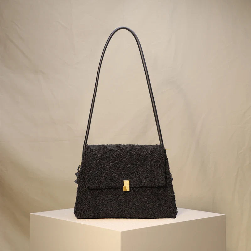 A stylish faux lamb wool crossbody bag in beige, black, or khaki brown with a contemporary design and practical storage features