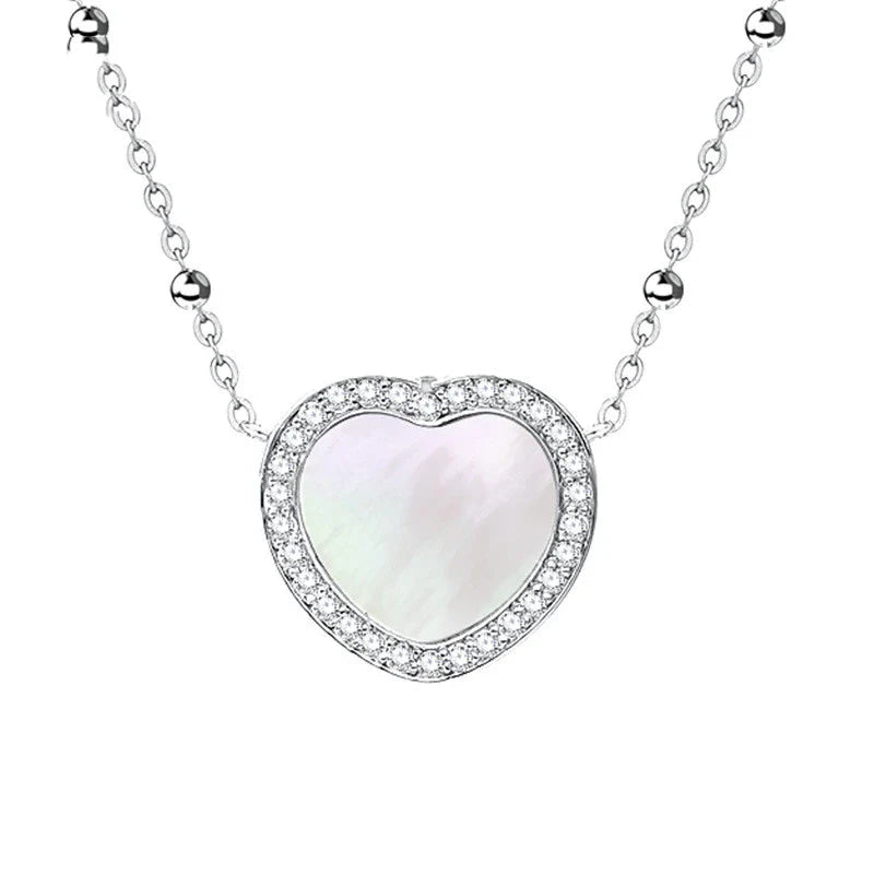 A rose gold or ice silver heart-shaped pendant necklace with an NFC chip for sending personalised digital messages